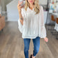 Eyelet Tassel Tie Flare Sleeve Blouse